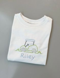 This Gender-Neutral Kids Tops & Tees item by StitchCraftKids has 2 favorites from Etsy shoppers. Ships from Birmingham, AL. Listed on Mar 11, 2024 White Custom Embroidery T-shirt For Summer, Hand Embroidery Kids Clothes, Baby Boy Embroidery Ideas, Hand Embroidered Name Shirt, Little Boy Embroidery Ideas, Disney Embroidery Shirts Kids, Embroidery Sweater Diy, Toddler Boy Embroidered Shirts, Embroidered Sweaters