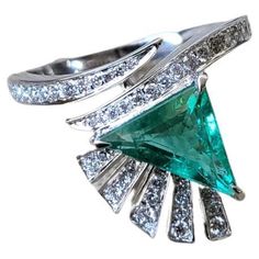 A very gorgeous and dainty, Emerald Engagement Ring set in 18K White Gold & Diamonds. The weight of the Emerald Trillion is 1.39 carats. The Emerald is completely natural, without any treatment and is of Zambian origin. The weight of the Diamonds is 0.30 carats. Net Gold weight is 4.49 grams. The dimensions of the ring are 1.50cm x 1.00cm x 2.20cm (L x W x D). The ring is made in US Size 6 and can be changed on request. Ring Gold Diamond, Emerald Engagement Ring Set, Diamond Ring Gold, Emerald Ring Engagement Diamond, Zambian Emerald, Gold Diamond Ring, Emerald Engagement, Emerald Engagement Ring, White Gold Ring