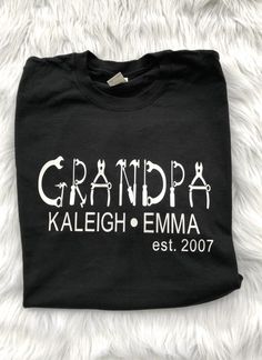 Custom Dad T-Shirt that comes personalized with kids names. Shirt can be customized to other names such as POP, PAPA, DADDY, GRANDPA, ABUELO, ect. Gildan brand adult Unisex short sleeve shirts will be used. They are 100% ring-spun cotton and are available in a variety of colors. The design is made with a high quality heat transfer vinyl that is professionally applied with an industrial heat press. I will be using the following color combinations unless other wise discussed. Black Tee- White desi Family Matching Custom Name T-shirt As A Gift, Custom Name T-shirt For Family Matching Gift, Custom Name Family Matching T-shirt, Family Matching T-shirt With Custom Name As Gift, Personalized Black Crew Neck T-shirt, Personalized Black Cotton T-shirt, Personalized Cotton T-shirt, Customizable Black T-shirt With Name Print, Custom Name Cotton T-shirt As Gift