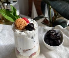 a dessert in a jar with fruit on top