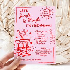 a hand holding up a pink card that says let's lunch and make it's friends