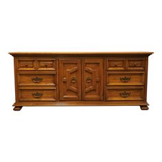 a wooden dresser with many drawers and doors on it's sideboard, isolated against a white background