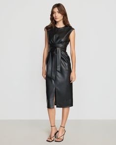 A sleek and modernized take on the LBD — this vegan leather dress is perfect for the office layered over a long-sleeve tee or on its own for date night. See below for our general Size Guide and available measurements Made of polyester, lining made of polyester Machine wash cold separately, tumble dry at low temperature, cool iron as needed Tie Front Dress, Faux Leather Dress, Leather Dress, The Office, Date Night, Size Guide, Vegan Leather, Long Sleeve Tees, Black Dress