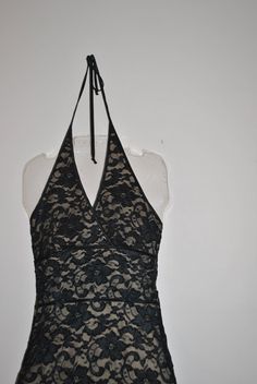 "Luxurious vintage 80s black french lace mini halter dress. Made by Georgiou studio. Elegant and simple design: Empire waist line. V neck line. Ties in the back with large tie-bow. Wide waist band on the front. Open back. Scalloped hem line. Fully lined of the beige polyester. Rich, feminine, classy. Excellent condition. Very clean inside and out. No damage. Ready to wear. Size Medium. Length of the arm hole to the hem line 34,0\" Bust stretched from 32,0\" to 38,0\" Waist line stretched from 28 Scalloped Hem, French Lace, Stretch Lace, Empire Waist, Pretty Dresses, Halter Dress, Simple Designs, Ready To Wear, Womens Dresses