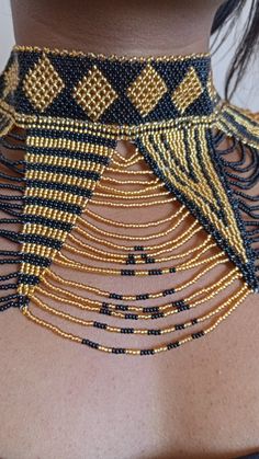 African wedding necklace, Zulu necklace, Beaded shawl necklace, African jewelry, Masai necklace, Bridesmaid necklace, Wedding gift This stunning necklace is superbly crafted with fine beads. The necklace can be worn with any outfit at different occasions and it will absolutely makes you stand out. 100% handmade using fine beads. Closure: ball joint Color: gold and black. 3-5 days delivery via DHL Express The shipping fee is for the first item only and additional necklaces or items ship for free. Traditional Tiny Beads Choker Necklace, Bohemian Beaded Necklaces With Round Beads For Wedding, Bohemian Tiny Beads Necklaces For Wedding, Bohemian Beaded Necklace With Round Beads For Wedding, Bohemian Beaded Necklaces For Wedding, Bohemian Beaded Choker Necklace For Wedding, Bohemian Beaded Bib Necklace For Wedding, Bohemian Tiny Beads For Wedding, Bohemian Wedding Necklaces With Tiny Beads