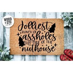 a door mat with the words jolieest, bunch of sassies this side of the nuthouse on it