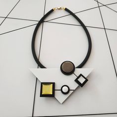 "Inspired by famous Piet Mondrian work, this is my interpretention of it. A monochromatic tones as opposed to Mondrian use of primary ones. Definitely a necklace for a stylish modern women! Lightweight necklace. * * * * * * * * * * * Materials: 0.24\"/6m\"m thick black silicon cord 0.12\"/3m\"m thick plexiglass resin acrylic colors Bib measurments: width: 4.7\"/12c\"m hight: 2.95\"/7.5c\"m maximum thicknes: 0.55\"/14m\"m Like wearing a set? check out shop's Clip On Earrings section: https://www. Modern Long Necklace For Party, Modern Handmade Necklaces For Party, Modern Geometric Jewelry With Unique Design, Contemporary Handmade Necklace, Elegant Geometric White Jewelry, Modern White Long Necklace, Elegant White Geometric Jewelry, Modern White Pendant Jewelry, Modern Handmade Long Necklace