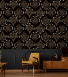 an art deco style wallpaper with gold and black designs on the walls, along with a yellow chair