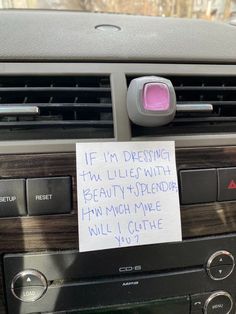 a car radio with a note attached to it