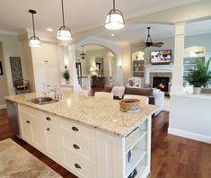 a large kitchen with an island in the middle