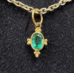 1. 18k Gold Zambian Emerald Pendant 2. Gold Granules 3. Gemstone - Zambian Emerald   4. Jewelry Type - Charms Pendant 5. Total Weight - 0.410 Gram Approx. 6. Emerald Weight - 0.30 Carats                7. Gold Weight - 0.350 Grams Approx. 8. Gold Purity - 18k 9. Pendant Bails Outer Size - 6 MM 10. Emerald Size - 4x5 mm  11. DIY Gold Accessories  12. Ready to Dispatch in 1 - 2 days. 13. Handmade Items 14. AAA Quality Pendant 15. 1 Quantity Available 16. Oval Green Emerald    Pictures are taken under natural and day light. Fine Jewelry Oval Emerald Necklace With Jewels, Oval Emerald Necklace With Jewels In Fine Jewelry Style, Oval Emerald Necklace With Jewels, Oval Emerald Gemstone Necklace In Yellow Gold, Oval Emerald Necklace In Yellow Gold, Hallmarked, Emerald Necklace Pendant, Gold Diy, Zambian Emerald, Pendant Bails