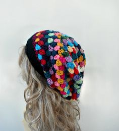 "This is a unique granny style hat made by me with many different colors. This one is slouchier and bigger then other slouchy hats in my shop. It is soft and comfortable. You can wear it with many different color outfits since it has a lot of colors. It is very hip and chic; everyone should have one of these hats in their closet for good or bad hair day! I used at least 15 different colors on this hat. Sizes: One size fits average teen or adult head size of 20\" to 22\". If you are interested in Slouchy Crochet Bohemian Beanie, Slouchy Bohemian Crochet Beanie, Bohemian Slouchy Crochet Beanie, Handmade Multicolor Slouchy Hat, Multicolor Handmade Slouchy Hats, Multicolor One Size Headband Hat, Multicolor Headband Hat, Multicolor Slouchy Crochet Beanie, Slouchy Multicolor Crochet Beanie