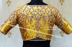 Golden (plain golden tissue fabric) blouse with beautiful jewelled hand embroidery (aari) done with silk thread, zadosi & stones. Made to Order Saree blouse (Any color Any size) Front open - with pads / without Padded (as per customer's requirement ) Princess cut Soft, light-weight and breathable fabric. If you could include following info in the note to whenever you placed the order, you will get best-matched blouse * Chest size: * Waist size: * Blouse Length: * Arm-hole: * Sleeve Loose: * Slee Work Blouse Designs Latest, Red Blouse Design, Tissue Fabric, Maggam Blouse, Golden Blouse, Aari Work Blouse, Gold Blouse, Saree Blouses, Red Blouse