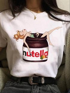 🍫 Indulge in whimsical sweetness with our delightful graphic tee showcasing a girl luxuriating in a Nutella bath! This charming and quirky design is a celebration of the joyous and deliciously fun side of life. 🛁 Crafted with high-quality fabric, this tee offers both comfort and style. The playful graphic of the girl immersed in a Nutella tub is sure to evoke smiles and spark conversations wherever you go. 😊 Whether you're a Nutella enthusiast, a lover of whimsical designs, or simply enjoy a 90s Harajuku, Mode Harajuku, Cartoon Tshirt, Women 90s, Style Kawaii, Trendy Streetwear, Cartoon Outfits, Harajuku Fashion, T Shirt Women