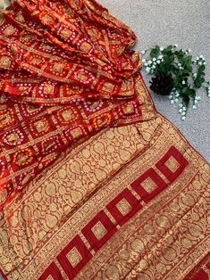 Bohemian Art Silk Saree With Bandhani Print, Navratri Chanderi Saree With Bandhani Print, Chanderi Saree With Bandhani Print For Navratri, Festive Bohemian Bandhani Saree, Unstitched Bollywood Saree With Bandhani Print, Bandhani Print Chinon Saree For Festivals, Bohemian Bandhani Print Saree, Navratri Puja Bandhani Saree, Navratri Bandhani Print Katan Silk Saree