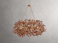 a chandelier with leaves hanging from it's sides and two lights on each side