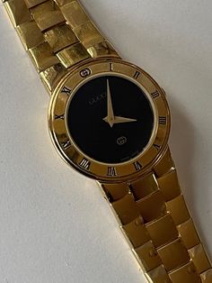 Gucci Ladies Gold Capped Black Dial Vintage Swiss Made Will fit up to 6.25 Wrist  In Great Working Condition, Keep Very Accurate Time. Just recently was serviced. Please have a look at our vintage watches we have constantly listed  MovementQuartz Case Case materialGold/Steel Case diameter27 x 30 mm  Thickness7 mm Bezel materialGold/Steel CrystalGlass DialBlack Dial numeralsRoman numerals Bracelet/strap Bracelet materialGold/Steel Bracelet colorGold ClaspFold clasp Other Only Original Parts Gold Caps, Woodland Hills, Women Wrist Watch, Swiss Made, Wrist Watches, Steel Bracelet, Vintage Watches, Vintage Gucci, Favorite Jewelry