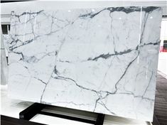 a large white marble slab on display in a store