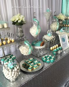 a table topped with lots of desserts and candies