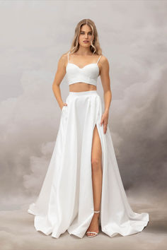 The Teffa Skirt is cut from structural Thai Taffeta that lends her her voluminous charm. Featuring a thick waistband that cinches in the small of the waist, an eye-catching thigh-high split, asymmetrical waist pleats and a sweeping train, this dramatic skirt is the perfect option for the modern bride. Wedding Dress Aesthetic, Prom Skirt, Catherine Deane, Wedding Dress Outfit, Statement Skirt, Knife Pleat, Bridal Skirts, Wedding Skirt, Bridal Separates