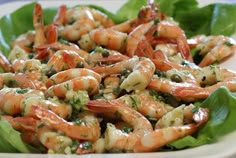 a white plate topped with shrimp and lettuce