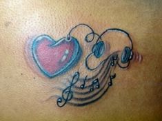 a tattoo with musical notes and a heart