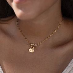 Express your love for someone special with this timeless monogram toggle necklace. Crafted with 14k gold fill or sterling silver paperclip chain, the tiny discs are hand-stamped with monogram letters. A perfect keepsake, this personalized statement necklace is sure to be cherished. DETAILSMonogram charms measure 8.9Offered in 16" or 18" lengthsAvailable in 14k Gold Fill and Sterling SilverHypoallergenic, Nickel-Free, and Water Safe Monogram Letter S, Scrapbook Book, Toggle Necklace, Handmade Fashion, Monogram Letters, Paper Clip, Hand Stamped, Metallic Silver, Gold Filled