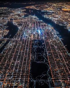 an aerial view of the city lights at night