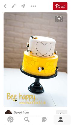 a yellow and white cake sitting on top of a table