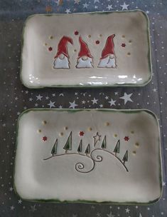 two christmas plates with santa hats and trees on them