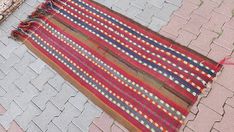 an old rug is laying on the ground