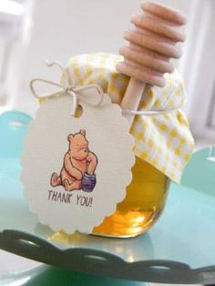 a jar filled with honey sitting on top of a table