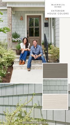 two people sitting on the front steps of a house with gray siding and white trim