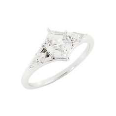 a white gold ring with three princess cut diamonds