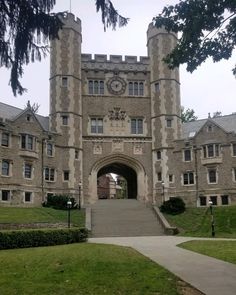 a large building with a clock on it's face and stairs leading up to the entrance