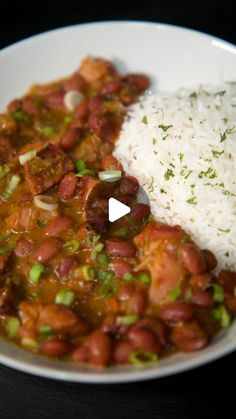 a white plate topped with beans and rice