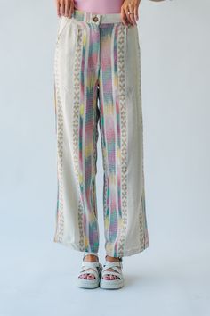 Introducing the Feia Embroidered Pant, perfect for adding some quirky style to your wardrobe. With colorful embroidery and a cream base, these pants are sure to make a statement. Step out in style while staying comfortable and unique. Details self: 61% acrylic + 22% polyester + 17% viscose lining: 100% cotton Fabric Care Guide Here Sizing & Fit Measurements are approximate and taken while laying flat across the front. Not doubled. small: waist = 15"; length = 42" ; inseam= 30" medium: waist = 15 Multicolor Floral Embroidered Bottoms For Spring, Traditional White Bottoms, Traditional White Wide Leg Bottoms, Casual Embroidered Pants For Loungewear, Embroidered Multicolor Bottoms For Summer, White Long Pants For Festivals, Casual Embroidered Beige Bottoms, Bohemian White Bottoms For Loungewear, Cream Bohemian Pants For Spring