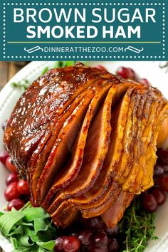 brown sugar smoked ham on a plate with cranberries and greens in the background