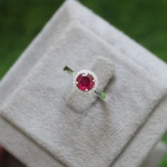 * Material: 925 Sterling Silver * DETAILS ✥ Handmade Ring ✥ - Center Stone: Lab Ruby - Center Stone Size: 6 MM - Center Stone Shape: Round - Side Stone: CZ Diamond  ✥ O T H E R ∙ I N F O R M A T I ON ✥ ♦ Your item will be nicely packed to gift in elegant jewelry boxes. ♦ Custom Order We can make custom rings in almost any shape and style. If you want a specific model, please send us a clear picture and we will do our best. ♦ Delivery All Item will be Shipped within 3 to 5 Days after payment receive. The delivery time usually takes 11 to 23 days, depending which Country & location. ♦ Payment we accept payment through PayPal only, Payment should be made within 3 days of purchase. ♦ Ring Size Visit your local jeweller to be sized, (Most offer this service for free). I can make this ring in si Round Cut Ring, Art Nouveau Ring, Ruby Engagement Ring, Ruby Jewelry, July Birthstone, Gift Ring, Red Ruby, Cz Diamond, Ruby Ring