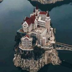 an aerial view of a castle in the water