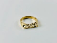 "Have a little fun and take your bling to another level with the Suave word ring. Stack it with other smaller rings. Pair it with other word rings like this one: https://www.etsy.com/listing/1063378702/rico-word-ring-rico-rich-word-ring?ref=shop_home_active_1&frs=1 word length: 16mm word height: 3 mm word width: 4 mm shank width: 1.5 mm This ring can be cast in brass, silver, or 14k gold plated over silver. If you are interested in solid gold please message me and we can discuss pricing. Love it Latina Rings, Jewelry Latina, Word Rings, Nameplate Ring, Latina Jewelry, Word Ring, Expensive Taste, Jewelry Words, Name Rings