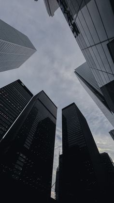 looking up at skyscrapers from the ground