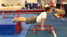 a young boy is practicing his acrobatic skills