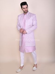 Item contains : Sherwani lavada and pants   Fabrics :   velvet indo  labada and shrug luxury lycra suiting Colours :  Pink and white  Style and Designs :  Sherwani Front open Jacket has mandarin collar and long sleeves with symmetric hem and multiple slits it  has all over off-white resham thread embroidery that make its sporting and beautiful  Lavada (shirt under the sherwani or kurta) has mandarin collar and long sleeves with symmetric hem and multiple slits it has embroidered buttons made of Sherwani Groom, House Clothes, Wedding Suits Men, White Style, Mandarin Collar, Wedding Men, Wedding Suits, Mens Suits, Fitness Models