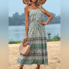 Step Into Summer With The Perfect Blend Of Style And Comfort With Our Green Boho Dress. This Stunning Green Midi Dress Is Designed To Capture The Essence Of Bohemian Fashion, Featuring A Sleeveless Design, V-Neckline, And Playful Tassel Spaghetti Straps. Made From 100% Viscose, This Dress Is Lightweight, Breathable, And Ideal For Those Warm, Sunny Days. Please Allow 7-10 Days For Shipping Womens Knee Length Dresses, Womens Summer Dresses, Sassy, Flattering, Stunning, Gorgeous, Make A Statement, Women's Casual Dresses, Irresistible, Date Night, First Date, Good Vibes, Feel Good, Comfortable, Sexy, Form Figure Hugging, Travel, Vacation, Resort Wear, Cruise, Beach, Cover Up, Dinner Date, Bar Green Boho Print Sundress For Spring, Green Bohemian Sundress For Garden Party, Green Bohemian Floral Dress For Summer, Green Boho Dress For Summer Garden Party, Boho Print Sundress For Garden Party, Casual Boho Print Floral Beach Dress, Boho Sundress With Boho Print For Garden Party, Bohemian Sleeveless Floral Dress, Green Bohemian Midi Floral Dress