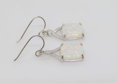 Vintage Sterling Silver Cushion White Opal CELTIC Dangle Earrings ....Marked 925...Total of weights 3.7grams...Measure H 1 2/8'' W 2/8''...These are in very good condition. Sterling Silver Drop Earrings With Bail, White Jewelry With Bail For Gift, White Nickel-free Earrings For Formal Occasions, White Nickel-free Formal Earrings, Nickel-free White Earrings For Formal Occasions, Hallmarked Rectangular White Jewelry, Formal White Nickel-free Earrings, Rectangular White Hallmarked Jewelry, White Sterling Silver Rectangular Jewelry