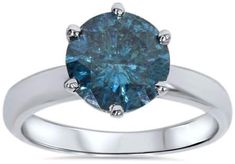 a blue diamond engagement ring set in white gold