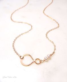 "Dainty Beaded Freshwater Pearl Necklace ~ Available in Rose Gold or Sterling Silver A simple and dainty infinity necklace - So simple and modern! - Small infinity link measures about 19mm - Genuine dainty and genuine freshwater pearls - Chain is a shimmery 14k gold fill, rose gold fill or sterling silver chain - Loop has a tiny stamp of authenticity of sterling or 24k gold metal on one side - Total necklace length shown at 17\" - Model has a size small neck - Necklace closes with a dainty and s Infinity Necklace With Delicate Chain For Wedding, Infinity Necklaces For Wedding On Mother's Day, Infinity Necklace With Adjustable Chain For Wedding, Dainty Infinity Necklace For Wedding, Adjustable Infinity Necklace For Wedding, Delicate Infinity Chain Wedding Jewelry, Bridesmaid Jewelry Gift, Neck Necklace, Infinity Necklace Gold