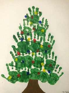 a child's handprint christmas tree is shown