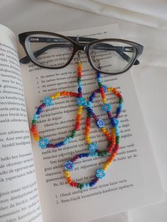 "You can always wear it easily. You can use it not only as eyeglass chain, but also as a necklace and bracelet with rainbow colors. Measures approx. 30\" (76 cm) total length Rainbow daisy sunglasses necklace will be a perfect gift for yourself and your loved ones. The price is for 1 piece of eyeglass chain. I can make it in any color you want. Please contact me. Thank you for visiting my store." Trendy Multicolor Glass Beaded Necklaces, Trendy Colorful Beaded Glasses Chains For Festivals, Adjustable Rainbow Glass Necklaces, Multicolor Beaded Glasses Chain For Gift, Multicolor Beaded Glasses Chain As Gift, Multicolor Beaded Chain Glasses Chains For Gifts, Multicolor Beaded Glasses Chains For Festival, Adjustable Rainbow Glass Necklace, Summer Multicolor Glasses Chains With Colorful Beads